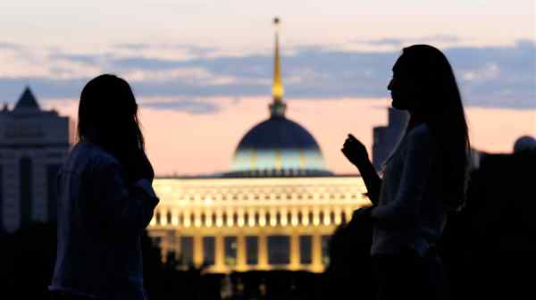 Women in front of the Akorda, the official residence of Kazakhstan's president in Nur-Sultan: The government says the proposed constitutional reforms will water down presidential powers.