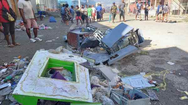 This street in the Solomon Islands capital of Honiara is strewn with rubble on Nov. 26.&nbsp;