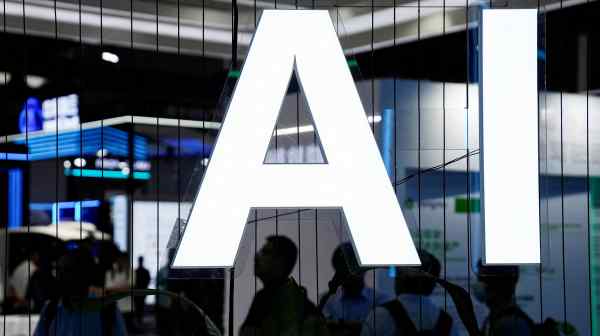 An AI&nbsp;sign is displayed at the World&nbsp;Artificial&nbsp;Intelligence&nbsp;Conference&nbsp;in Shanghai on July 6. Chinese courts have been quick to set precedents on various aspects of the technology.