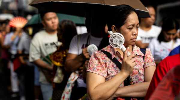 A woman tries to cool down in the Philippines&nbsp;in&nbsp;April 2024. People around Asia should expect more scorching weather as the year unfolds.&nbsp;