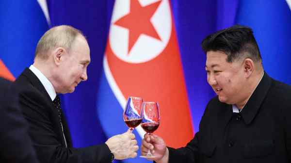 Russia's President Vladimir Putin and North Korea's leader Kim Jong Un attend a state reception in Pyongyang on June 19.