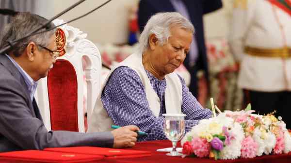 Nobel laureate Muhammad&nbsp;Yunus&nbsp;signs the oath book to take over as head of Bangladesh's&nbsp;interim government in Dhaka.