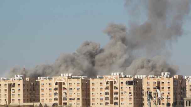 Smoke rises following an Israeli strike on a residential building in Khan Younis, in the southern Gaza Strip, on Aug.&nbsp;16.