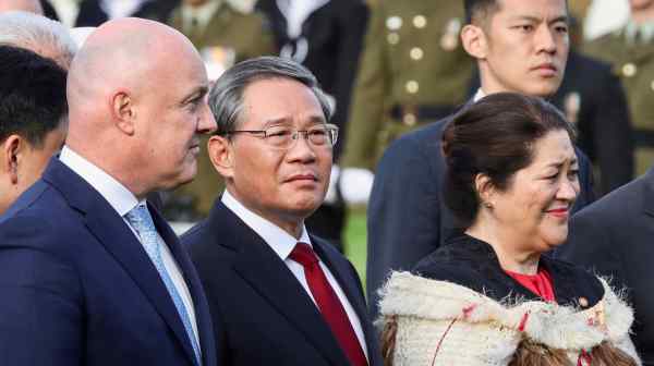 Chinese Premier Li Qiang, center, is welcomed by New Zealand Prime Minister Christopher Luxon, left, and New Zealand Gov.&nbsp;General Dame Cindy&nbsp;Kiro&nbsp;in Wellington on June 13.