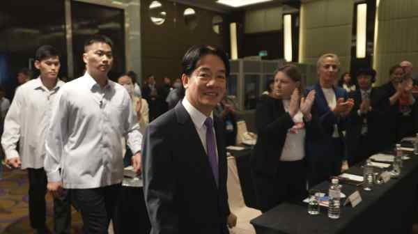 Taiwanese President Lai Ching-te arrives to speak to&nbsp;a gathering of foreign lawmakers in Taipei on&nbsp;July 30, telling the&nbsp;conference Taiwan will work with others&nbsp;to protect democracy from "the threat of authoritarian expansionism."