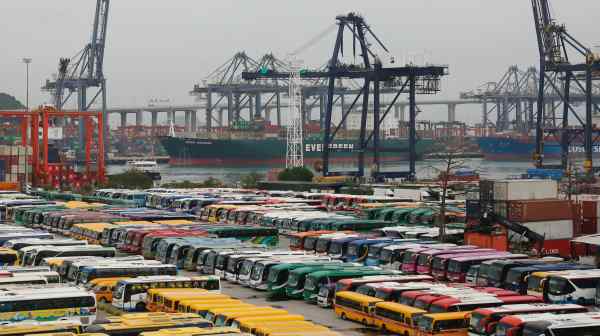 Tourist and school buses are seen at a parking lot near Kwai Chung Container Terminal in Hong Kong, April 1: The novel coronavirus outbreak has devastated the territory's tourism industry.