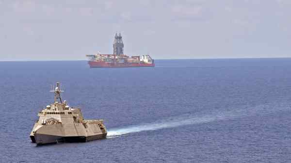 USS Gabrielle Giffords conducts routine operations near a drill ship in South China Sea on May 12: the U.S. has been unwavering in its mission to preserve regional peace and stability. (Handout photo from the U.S. Navy)