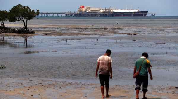 A LNG carrier is docked at the ExxonMobil PNG operated plant at Caution Bay, Papua New Guinea in November 2018: the local people have seen very little of the promised benefits.