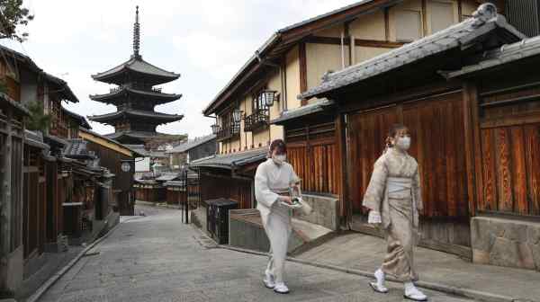 Two women walk on an unusually empty street in Kyoto on Jan. 13: we must have the courage to recognize that old-fashioned tourism is over.