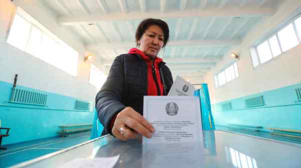 A voter casts her ballot during Kazakhstan's&nbsp;parliamentary election on March 19.