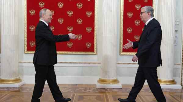 Kazakh President Kassym-Jomart&nbsp;Tokayev, right, met with President Vladimir&nbsp;Putin in Moscow on Russia's Victory Day in May. (Pool via Reuters)