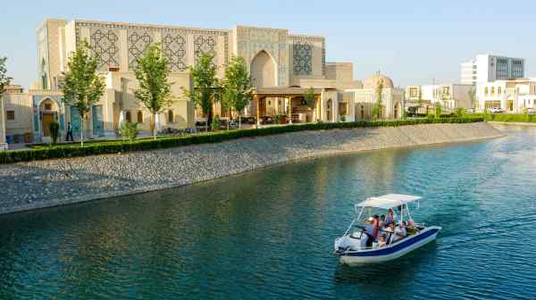 A canal surrounds Uzbekistan's&nbsp;Silk Road Samarkand Tourist Complex. Opened in 2022, the site&nbsp;is at the center of efforts to draw more international visitors. (Photo by David Andreas)