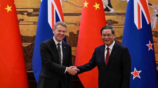 New Zealand Prime Minister&nbsp;Chris&nbsp;Hipkins, left, and Chinese Premier Li Qiang&nbsp;meet at the Great Hall of the People in Beijing in June. (Pool via Reuters)