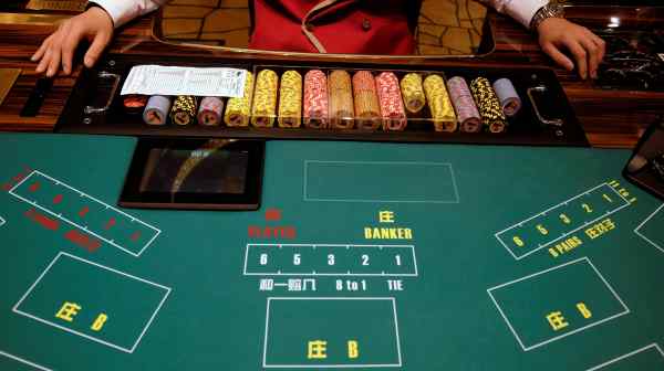 An MGM Cotai employee prepares for the opening of the casino in&nbsp;Macau, China. Investors are beginning to see Macau&nbsp;casinos' bonds as "promising."