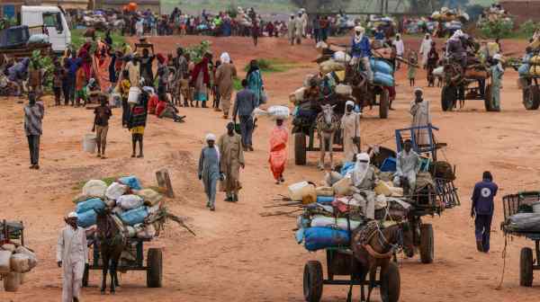 People fleeing the violence in West Darfur, Sudan, cross the border into Chad in August 2023.