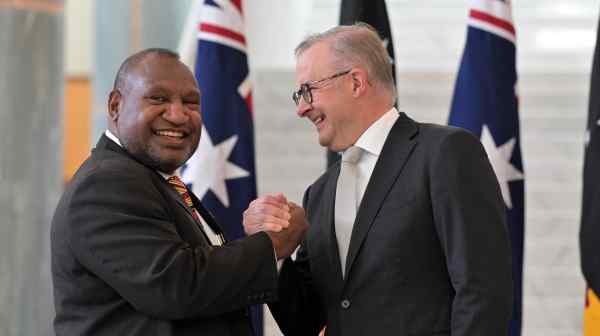 Australian&nbsp;Prime Minister Anthony Albanese, right, greets Papua New Guinea&nbsp;Prime Minister James Marape&nbsp;at Parliament House in Canberra on Feb. 8. (AAP Image via AP)