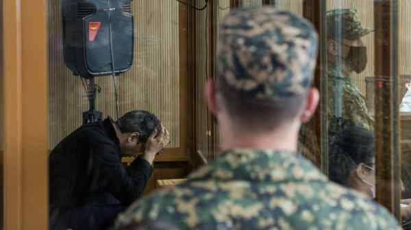 Former Kazakh Economy Minister Kuandyk Bishimbayev during a court hearing in Astana on May 13, when he was found guilty of murdering his common-law wife and sentenced to 24 years in prison.