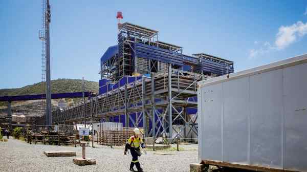 A worker walks past the Koniambo Nickel SAS (KNS) Vavouto site, near Kone on New Caledonia on Feb. 28, following the suspension of operations.