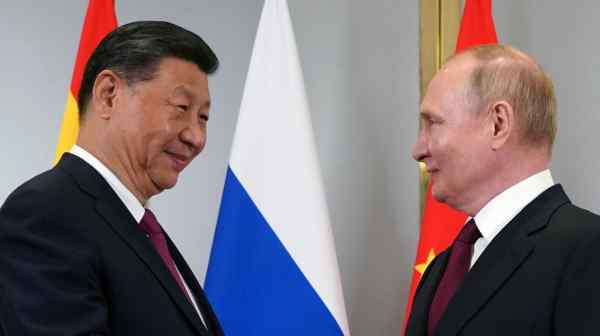 Russian President Vladimir&nbsp;Putin&nbsp;greets Chinese President&nbsp;Xi&nbsp;Jinping during a meeting on the sidelines of the Shanghai Cooperation Organization&nbsp;summit in Astana, Kazakhstan, on July 3. (Sputnik/Pool photo via Reuters)