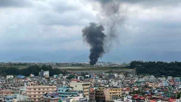 Smoke rises from the Tribhuvan International Airport in Kathmandu on July 24, 2024 after a plane slipped off the runway and crashed while trying to take off.&nbsp;