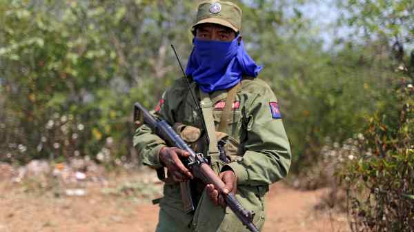 A soldier from the Myanmar National Democratic Alliance Army (MNDAA) on guard at a rebel military base in the Kokang region. (REUTERS/Stringer)