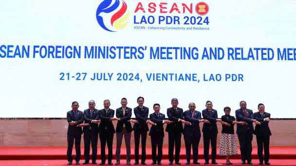 Foreign ministers of Southeast Asian countries pose for a photo on the day of the 57th ASEAN Foreign Ministers' Meeting at the National Convention Centre in Vientiane on&nbsp;July 25.