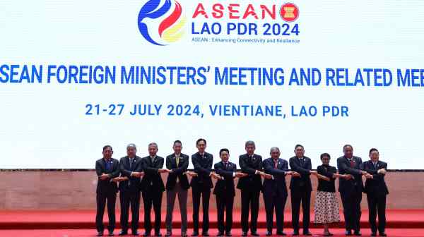 Foreign ministers of Southeast Asian countries pose for a photo on the day of the 57th ASEAN Foreign Ministers' Meeting at the National Convention Centre in Vientiane on&nbsp;July 25.