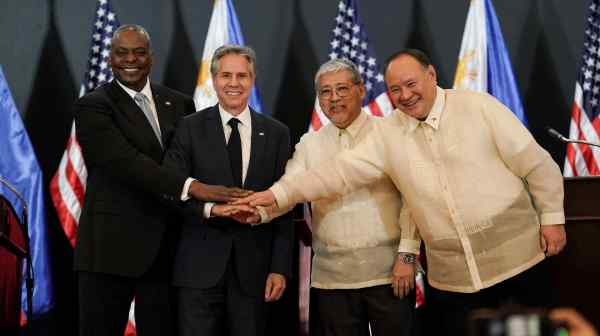 Left to right: U.S. Secretary of Defense Lloyd Austin, U.S. Secretary of State Antony Blinken, Philippine Foreign Minister Enrique Manalo, and Philippine Defence Minister Gilberto Teodoro pose for a photo after their joint press conference at Camp Aguinaldo, in Quezon City, Metro Manila on July 30.