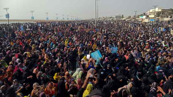 Supporters of the Balochistan Yakjehti Committee listen to their leader speak during the Baloch National Gathering in Gwadar on the southwestern coast of Pakistan on July 28.