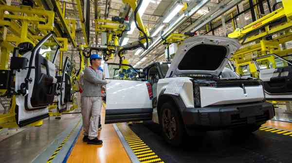 Employees work on the production line at a&nbsp;factory&nbsp;for Chery's electric vehicles) in Wuhu, Anhui province,&nbsp;China, on July 29.