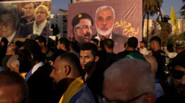 Supporters of Hamas and Hezbollah take part in a protest condemning the killing of Hamas leader Ismail Haniyeh and Hezbollah top commander Fuad Shukr, in Sidon, Lebanon, on Aug. 2.