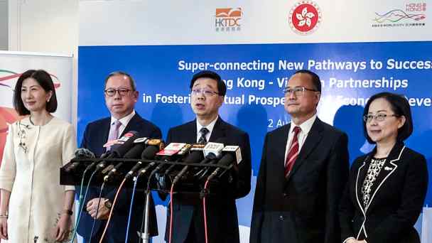 John Lee, center,&nbsp;in Ho Chi Minh City. He is the first Hong Kong chief executive to visit Vietnam, Cambodia&nbsp;and Laos.&nbsp;(Photo by Lien Hoang)