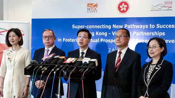 John Lee, center,&nbsp;in Ho Chi Minh City. He is the first Hong Kong chief executive to visit Vietnam, Cambodia&nbsp;and Laos.&nbsp;(Photo by Lien Hoang)