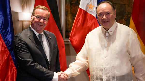 German Defence Minister Boris Pistorius and Philippine Defence Minister Gilberto Teodoro shake hands before their bilateral meeting, in Makati, Metro Manila on Aug. 4.