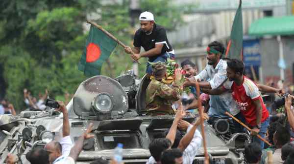 Anti-government protesters&nbsp;celebrate in Dhaka on Aug. 5 after the fall of&nbsp;Bangladeshi Prime Minister Sheikh Hasina.