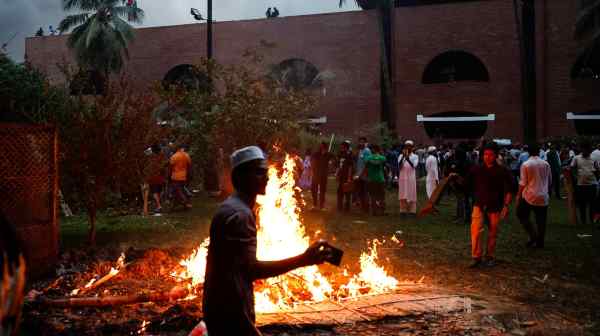 People enter former Bangladesh Prime Minister Sheikh Hasina's&nbsp;official residence in Dhaka&nbsp;after her&nbsp;resignation on Aug. 5.