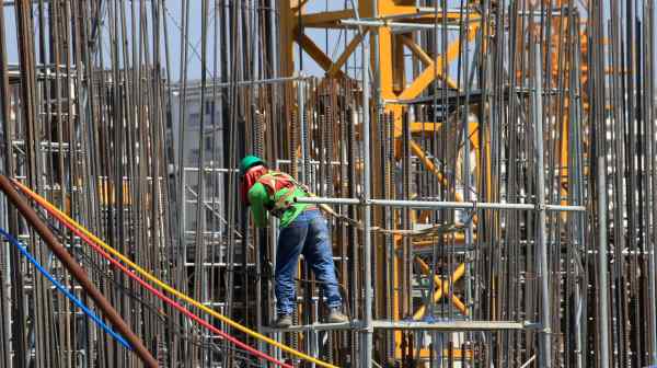 A worker installs steel rods at a&nbsp;construction&nbsp;site in Paranaque, a&nbsp;city in&nbsp;Metro Manila.