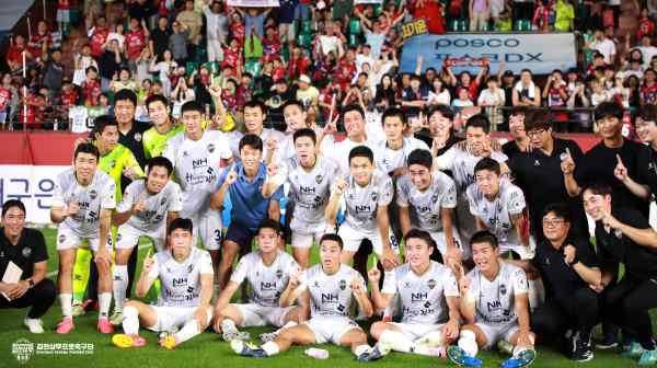 Members of the Gimcheon Sangmu soccer club pose after a match. The team of military conscripts is a beat away from finishing in first place. (Photo from Sangmu's website)