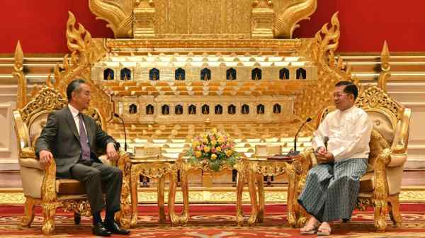 Myanmar's military leader Senior Gen. Min Aung Hlaing, right, talks with Chinese Foreign Minister Wang Yi, Naypyitaw, Myanmar, on Aug. 14.&nbsp;(Myanmar Military Information Team via AP)