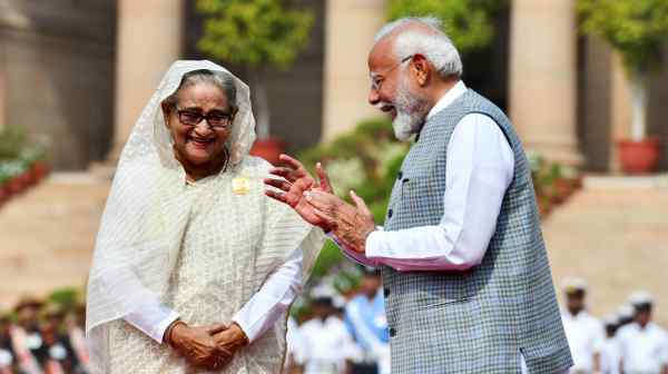 India's Narendra Modi speaks with then-Bangladesh&nbsp;Prime Minister Sheikh Hasina in New Delhi on&nbsp;June 22. Hasina was later ousted and fled to India.