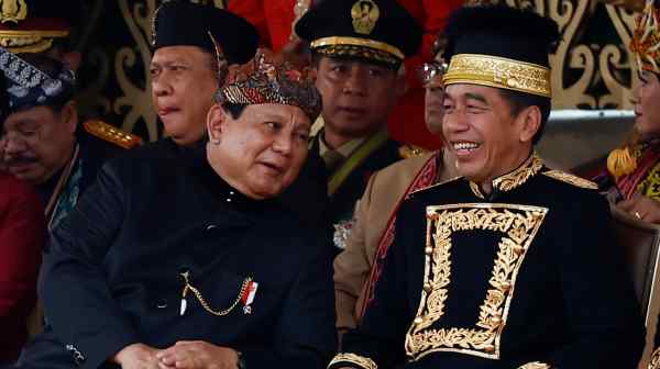 Indonesian President-elect and Defense Minister Prabowo Subianto, left, talks with President Joko Widodo during the country's 79th Independence Day celebration at the Presidential Palace in the new capital city of Nusantara, on Aug. 17.