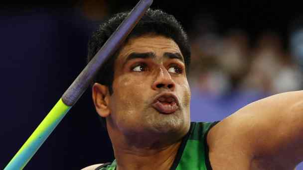 Pakistani Olympic gold medalist Arshad Nadeem throws the javelin at the&nbsp;Stade de France on Aug. 8.