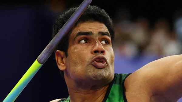 Pakistani Olympic gold medalist Arshad Nadeem throws the javelin at the&nbsp;Stade de France on Aug. 8.