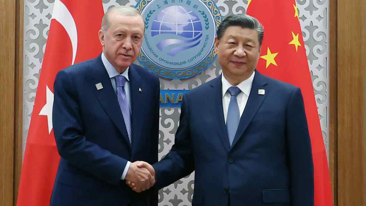 Turkish President Recep Tayyip Erdogan, left, meets with Chinese President Xi Jinping at the&nbsp;Shanghai Cooperation Organization Summit in Kazakhstan on July 4. (Turkish presidency)