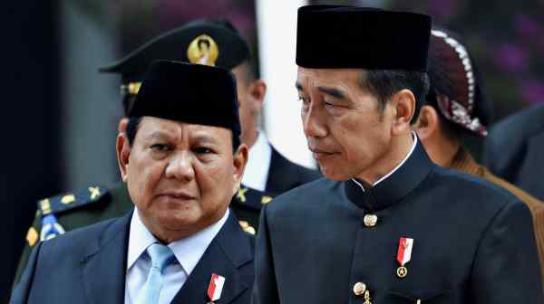 Indonesian&nbsp;President-elect Prabowo Subianto, left, with President Joko 'Jokowi' Widodo at the parliament building. All but one party with seats in the House of Representatives has joined Prabowo's coalition.