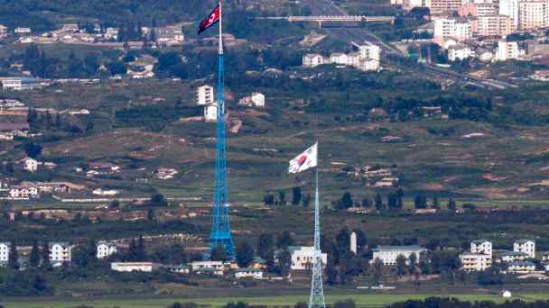 National flags flutter at the border dividing the Korean Peninsula.