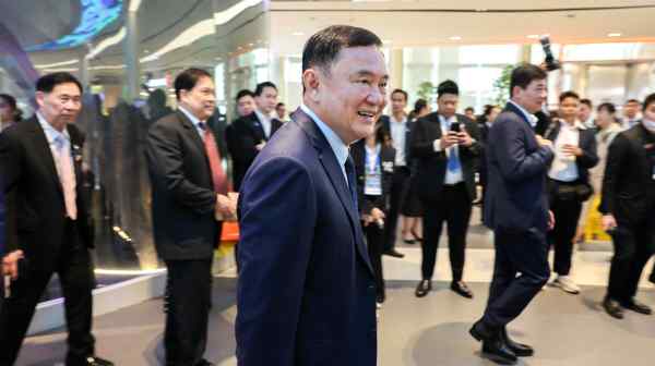 Former Thai Prime Minister Thaksin Shinawatra arrives for a nationally televised speech on his vision for Thailand.