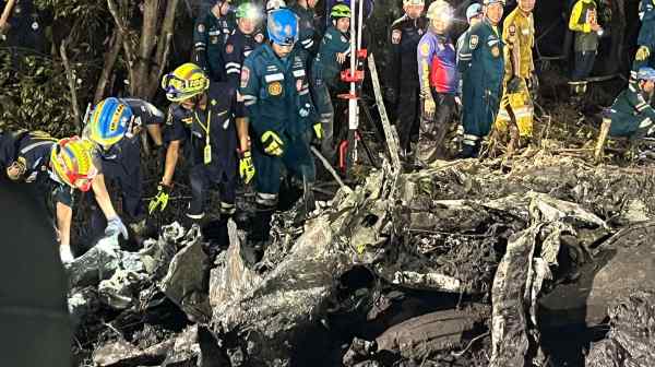 A rescue team works at the site of a small aircraft&nbsp;crash in Thailand's Chachoengsao province on Aug. 22.&nbsp;(Chachoengsao's Public Relations Department via AP)