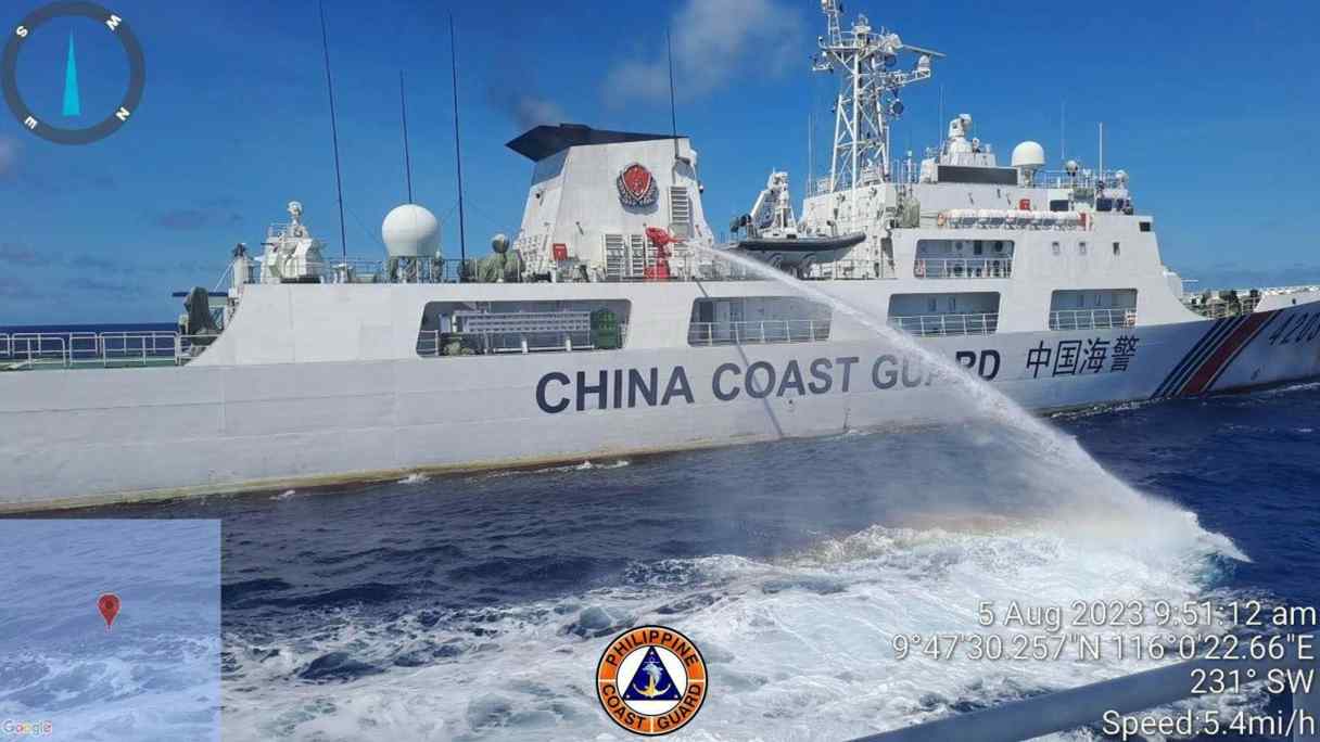 A Chinese coast guard ship uses water canons on a Philippine Coast Guard ship near the Philippine-occupied Second Thomas Shoal, South China Sea as they blocked it's path during a re-supply mission on Aug. 5, 2023. (Philippine Coast Guard via AP)