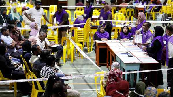 Maldives electoral workers prepare to count ballots&nbsp;during the first round of the presidential election on Sept. 9.